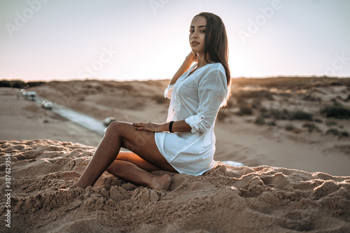 moroccan girl in the dunes of the south of spain and beach coast white tarifa bolonia
