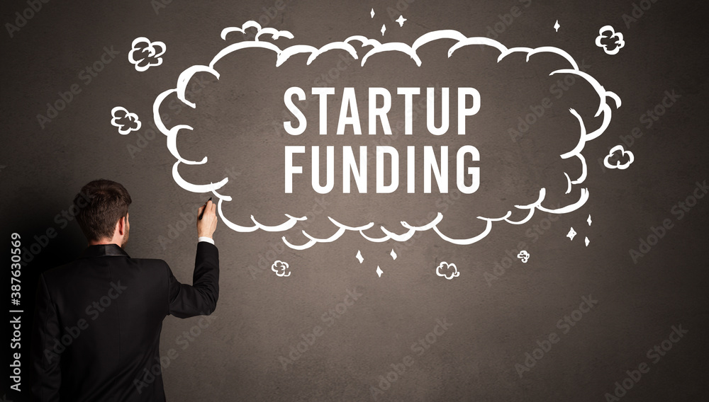 businessman drawing a cloud with STARTUP FUNDING inscription inside, modern business concept businessman drawing a cloud with STARTUP FUNDING inscription inside, modern business concept