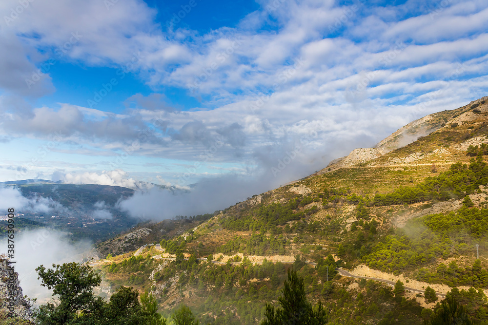 Confrides mountain´s port in the morning one day with low fog and clouds.