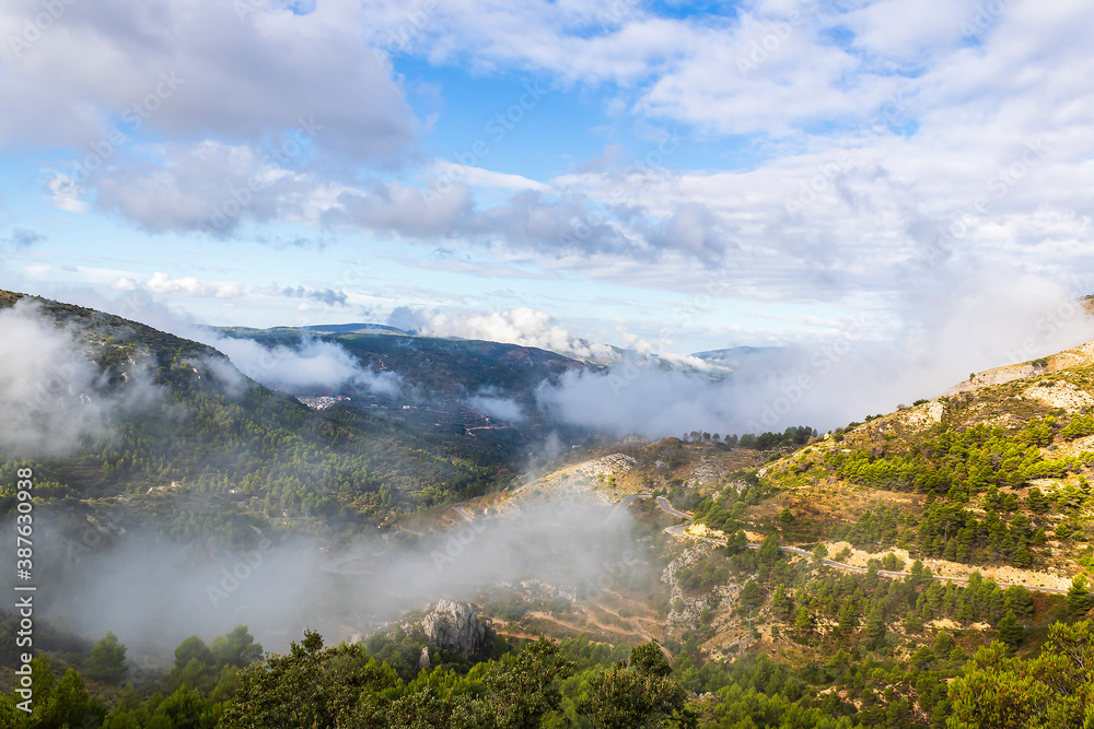 Confrides mountain´s port in the morning one day with low fog and clouds.