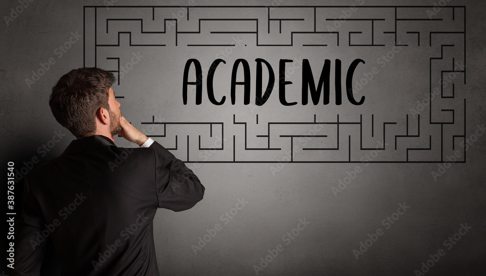 businessman drawing maze with ACADEMIC inscription, business education concept