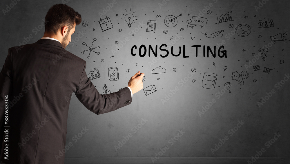 businessman drawing a creative idea sketch with CONSULTING inscription, business strategy concept businessman drawing a creative idea sketch with CONSULTING inscription, business strategy concept