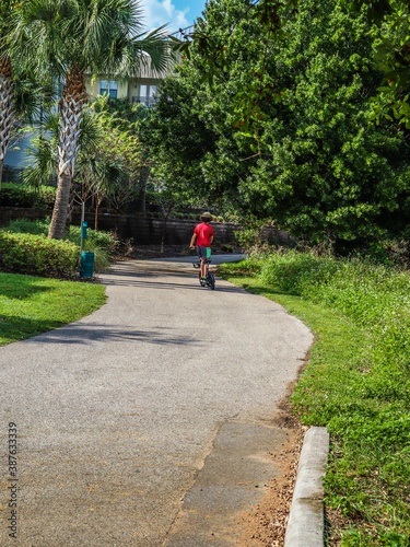 Wallpaper Mural person riding a bicycle at the park. Torontodigital.ca