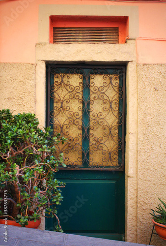An old building door reflecting the historical texture of Italy. photo