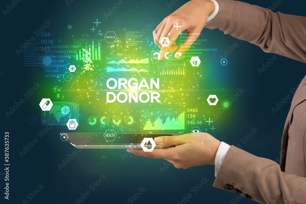Obraz premium Close-up of a touchscreen with ORGAN DONOR inscription, medical concept