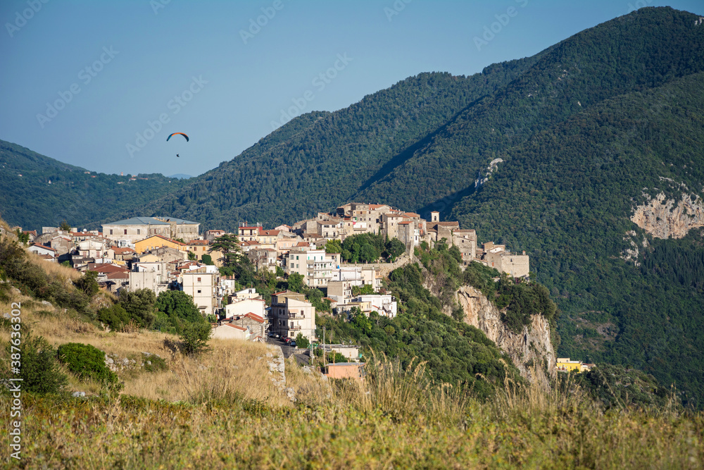 Beautiful Norma village with ancient romanesque ruins and medieval houses on the top of the hill. Traditional Italian landscape