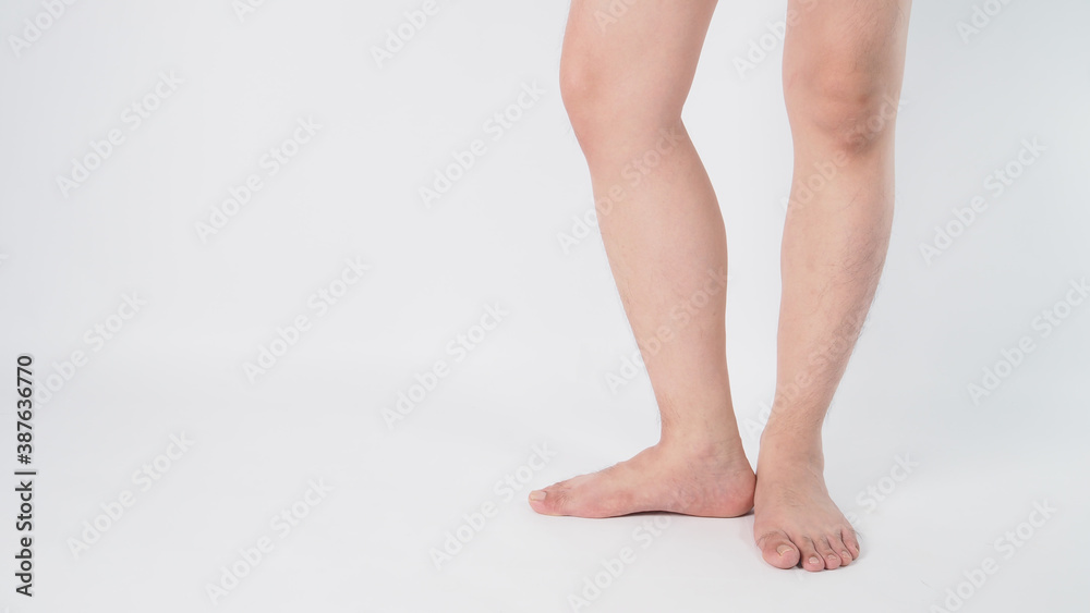 Male legs and barefoot is isolated on white background. Male legs and barefoot is isolated on white background.