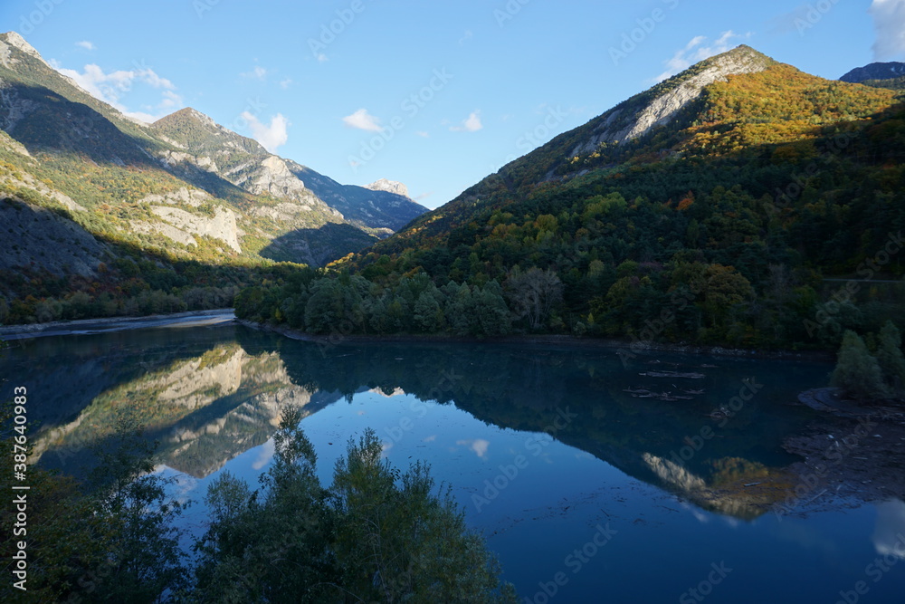 reflection of the fall colors in lake Serre Ponçon, France
