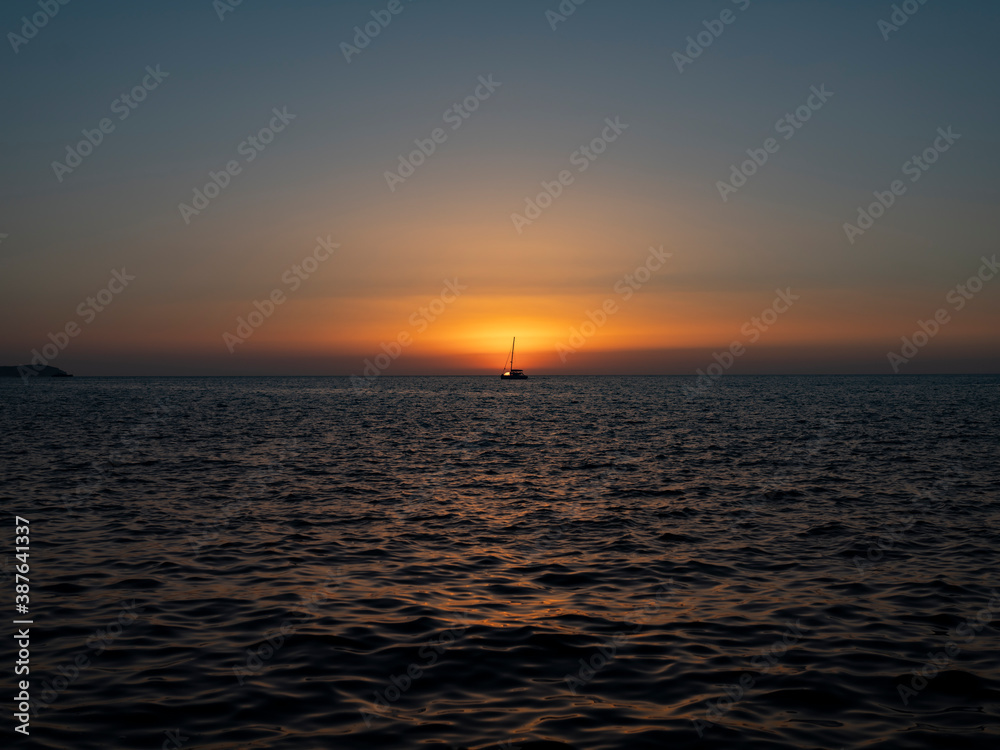 ship crosses the sea in the sunset ship crosses the sea in the sunset
