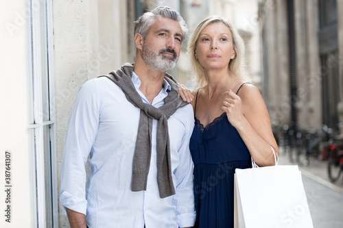 mature couple enjoying in shopping together © auremar