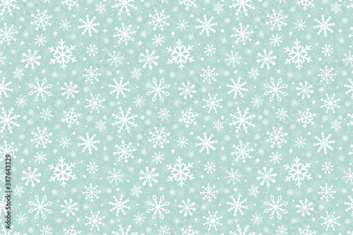 Christmas background with snowflakes. Design of winter seamless pattern. Vector