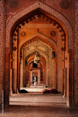 Graphic red doorway Mughal architecture in Indian landmark Jama Masjid in Fatehpur Sikri, Uttar Pradesh India