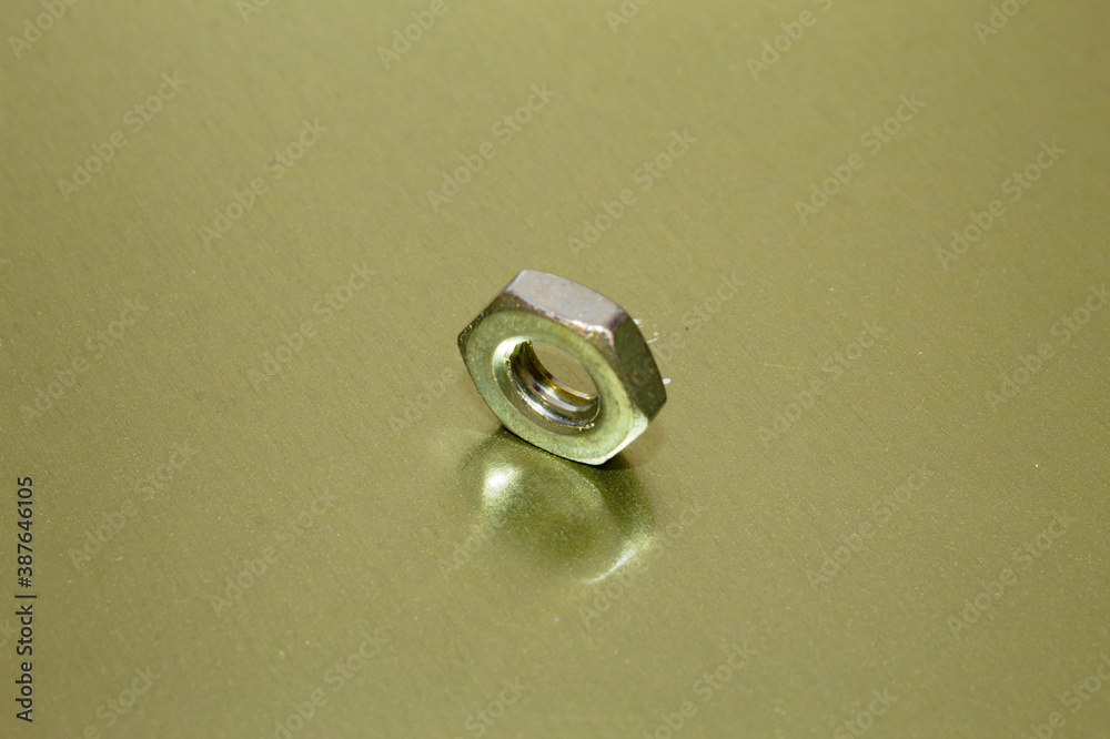 Screw washer with reflection on gold background Screw washer with reflection on gold background