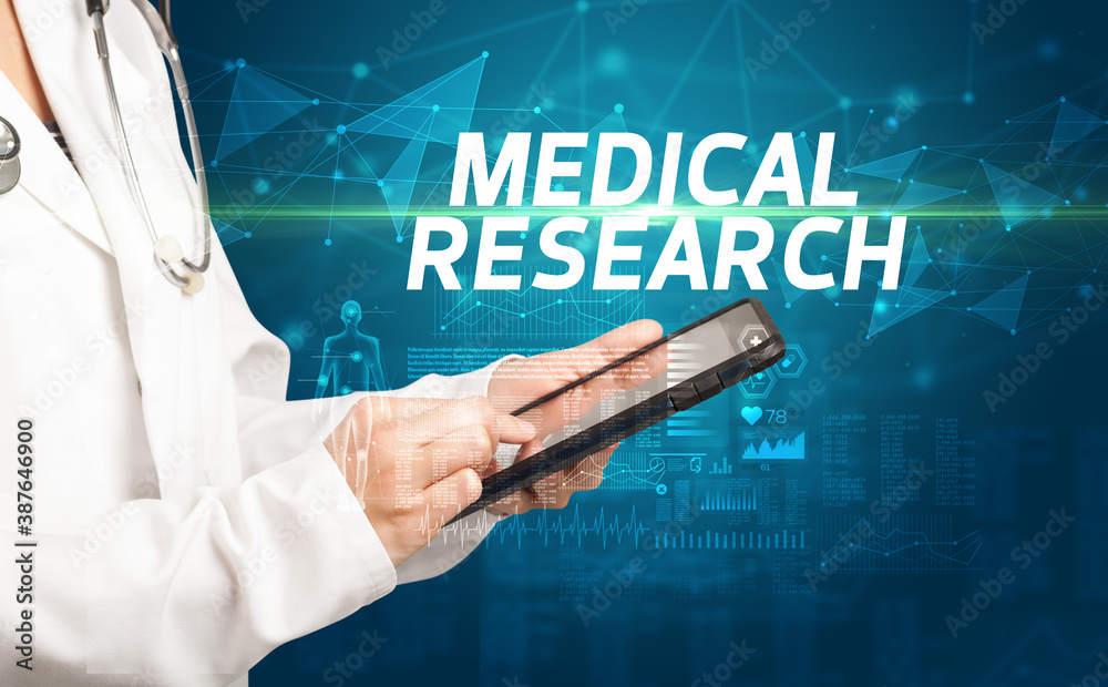 doctor writes notes on the clipboard with MEDICAL RESEARCH inscription, medical diagnosis concept doctor writes notes on the clipboard with MEDICAL RESEARCH inscription, medical diagnosis concept
