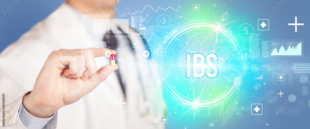 Close-up of a doctor giving you a pill with IBS abbreviation, virology concept Close-up of a doctor giving you a pill with IBS abbreviation, virology concept