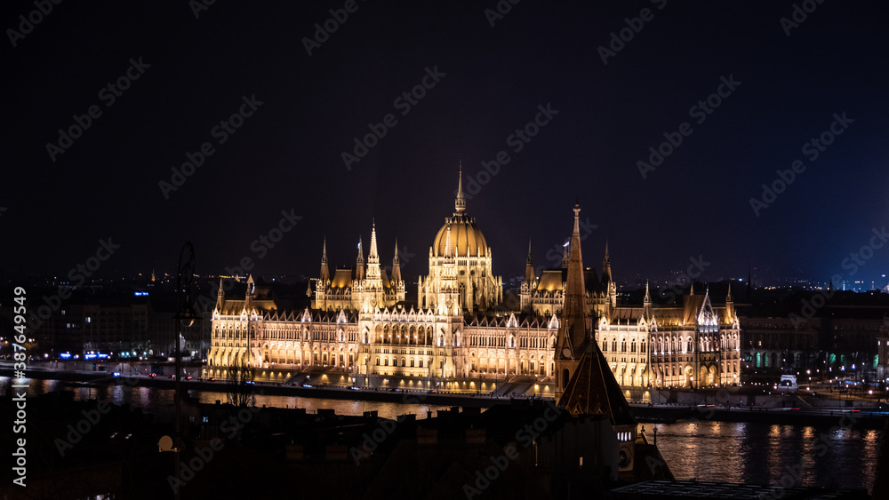 Panorama of city and Hungarian Parliament Building. Night in Budapest, Hungary.