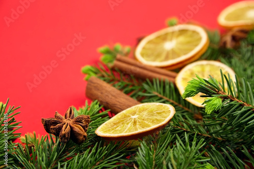 Dry orange slices with christmas tree branches, cinnamon and anise spices
