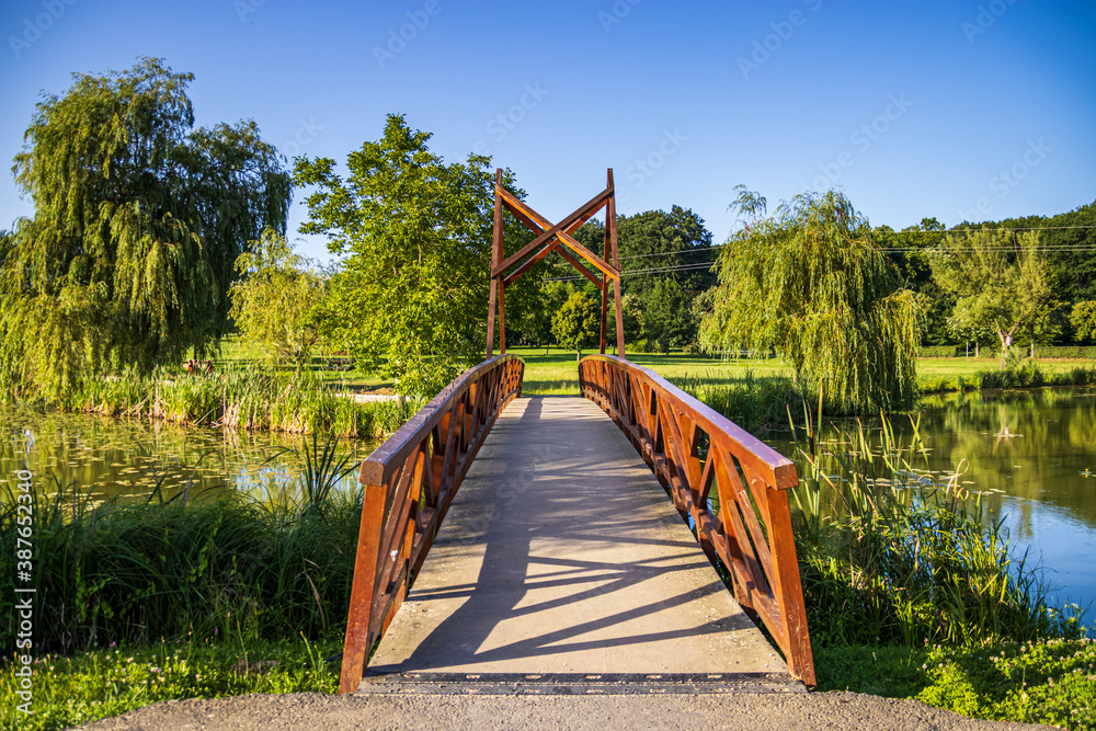 A wooden bridge over the boating lake (Csonakazo to) in City Kanizsa, Hungary