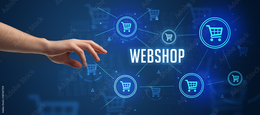 Close-Up of cropped hand pointing at WEBSHOP inscription, online shopping concept