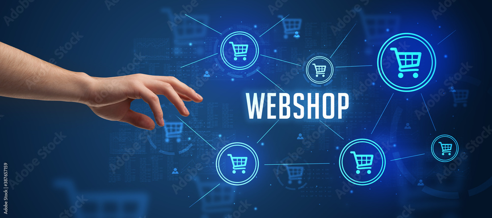Close-Up of cropped hand pointing at WEBSHOP inscription, online shopping concept Close-Up of cropped hand pointing at WEBSHOP inscription, online shopping concept
