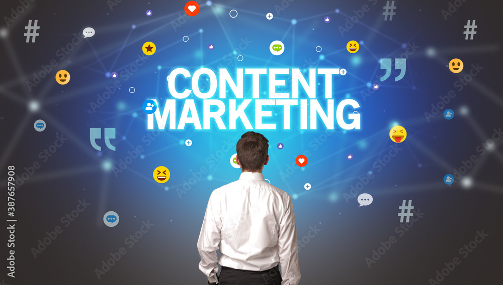 Rear view of a businessman with CONTENT MARKETING inscription, social networking concept Rear view of a businessman with CONTENT MARKETING inscription, social networking concept