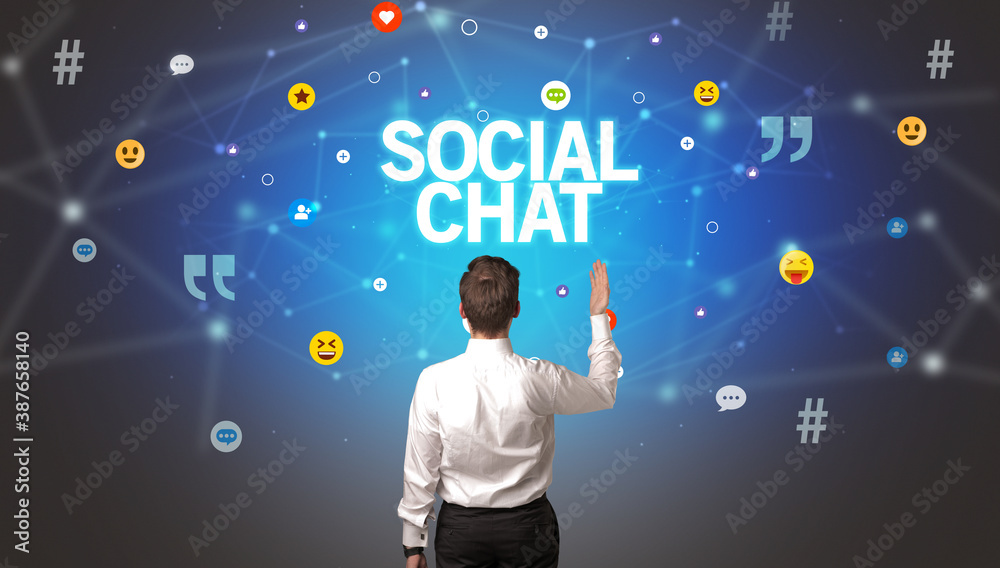 Rear view of a businessman with SOCIAL CHAT inscription, social networking concept Rear view of a businessman with SOCIAL CHAT inscription, social networking concept