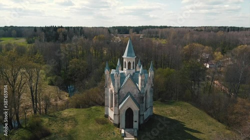 Breathtaking aerial view of gothic church in the forest