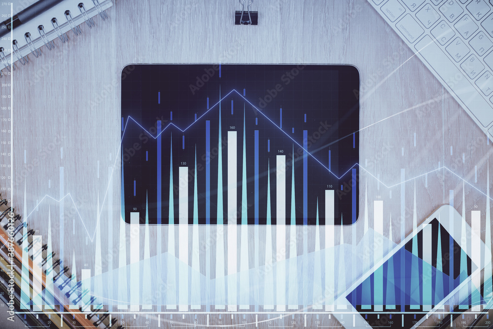 Double exposure of forex graph hologram over desktop with phone. Top view. Mobile trade platform concept. Double exposure of forex graph hologram over desktop with phone. Top view. Mobile trade platform concept.