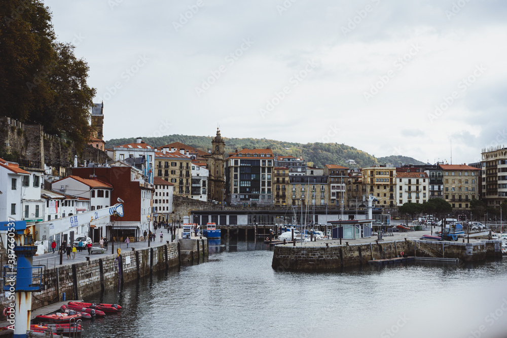 The old seaport of Donostia with the city in the background.
