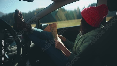 Wallpaper Mural Woman during social distancing and solo activity concept. Active and positive lifestyle. Pretty girl studying the map and sitting in car during her roadtrip after long quarantine self isolation. Torontodigital.ca