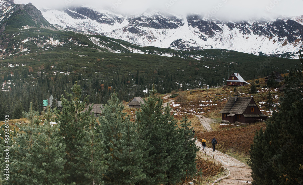 old wooden village in the mountains in autumn, winter in Tatry, Poland. Christmas landscape of social distance simple living, no civilization area.