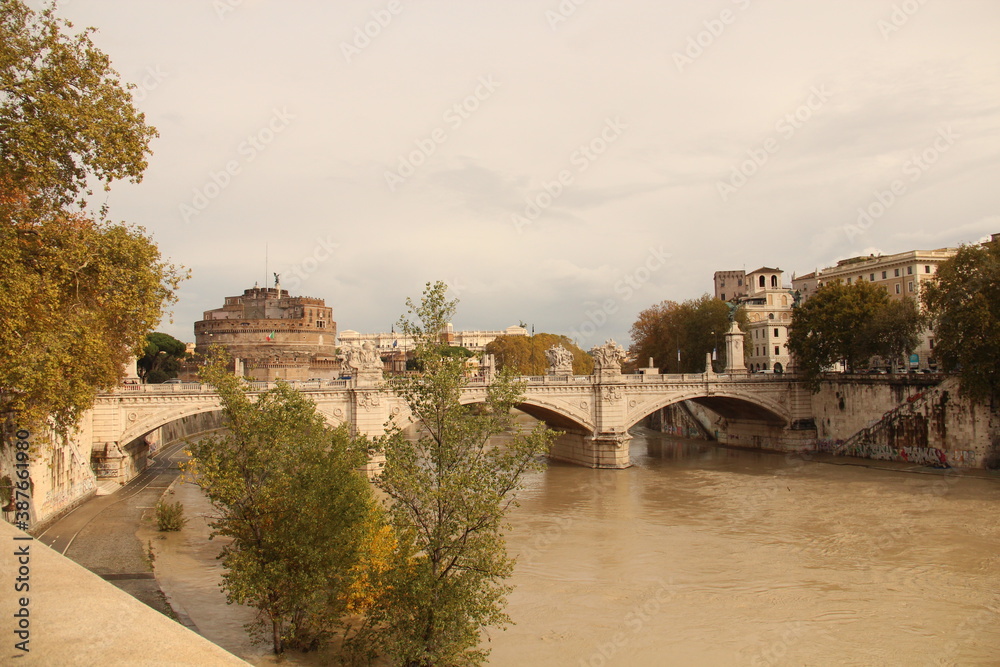 Tiber river and behind is Castel Sant'Angelo.