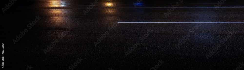 Wet asphalt, night view, neon reflection on the concrete floor. Night empty stage. Dark abstract background, dark street. Night city after rain, wet surface. Blurred background, night bokeh.