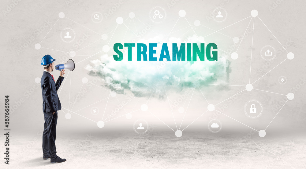 Engineer working on a social media concept with STREAMING inscription Engineer working on a social media concept with STREAMING inscription