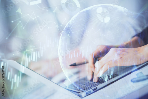 Double exposure of woman hands typing on computer and forex chart hologram drawing. Stock market invest concept.