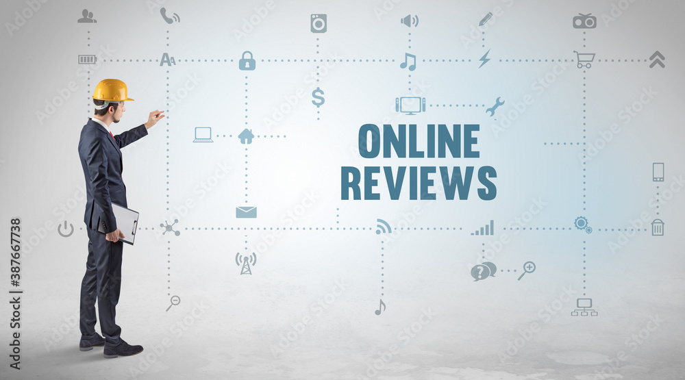 Engineer working on a new social media platform with ONLINE REVIEWS inscription concept Engineer working on a new social media platform with ONLINE REVIEWS inscription concept