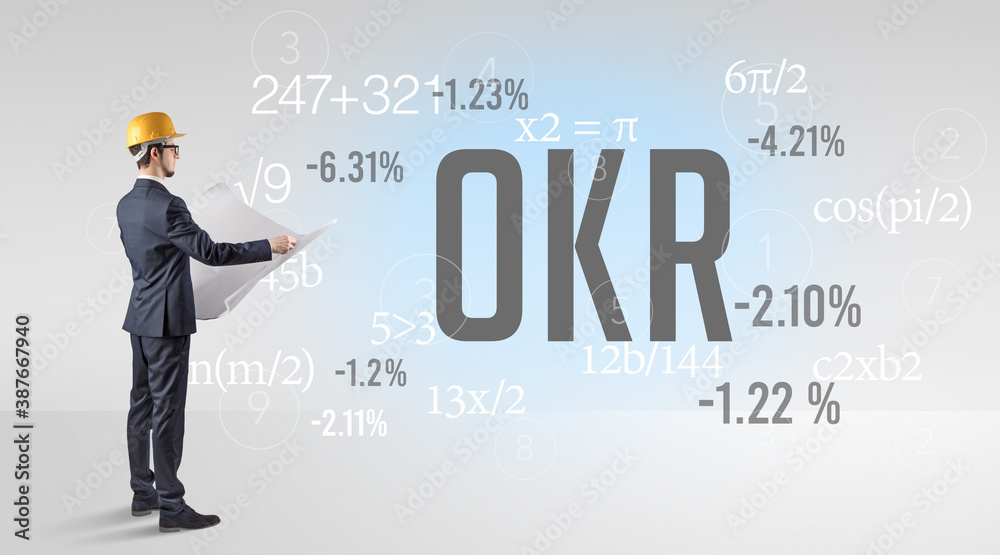 Technology Engineer in hard hat with OKR abbreviation Technology Engineer in hard hat with OKR abbreviation