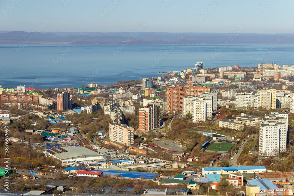 Vladivostok, Russia - October, 27, 2019: View of the industrial and residential areas of Vladivostok from the top of the Kholodilnik Hill.