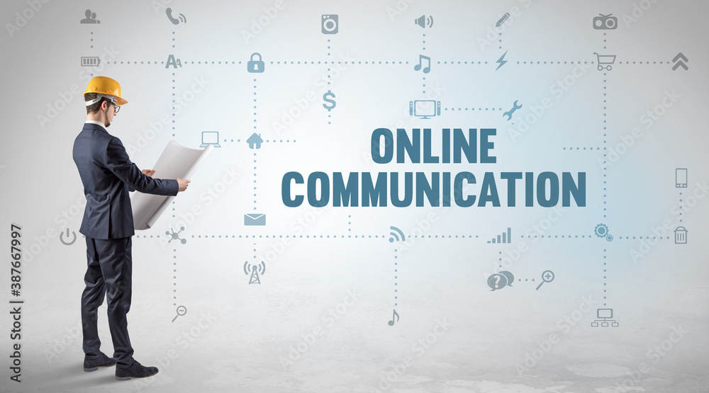 Engineer working on a new social media platform with ONLINE COMMUNICATION inscription concept Engineer working on a new social media platform with ONLINE COMMUNICATION inscription concept