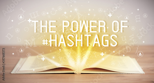 Open book with THE POWER OF #HASHTAGS inscription, social media concept
