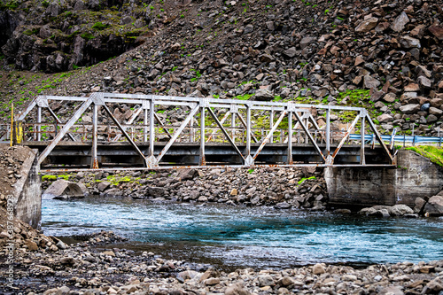 Ring road in east Iceland highway with bridge and colorful blue water nobody empty near Djupivogur
