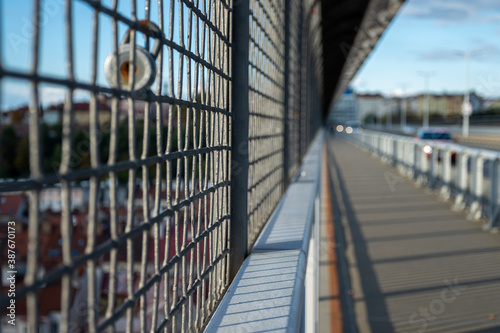 detail of an iron fence in the city center and blurred background