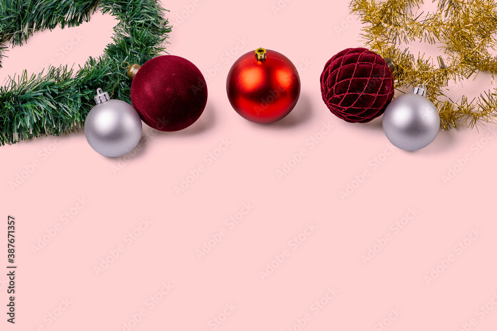 Beautiful Christmas ball decorations isolated on red background. Postcard. Christmas and New Year holidays concept background.