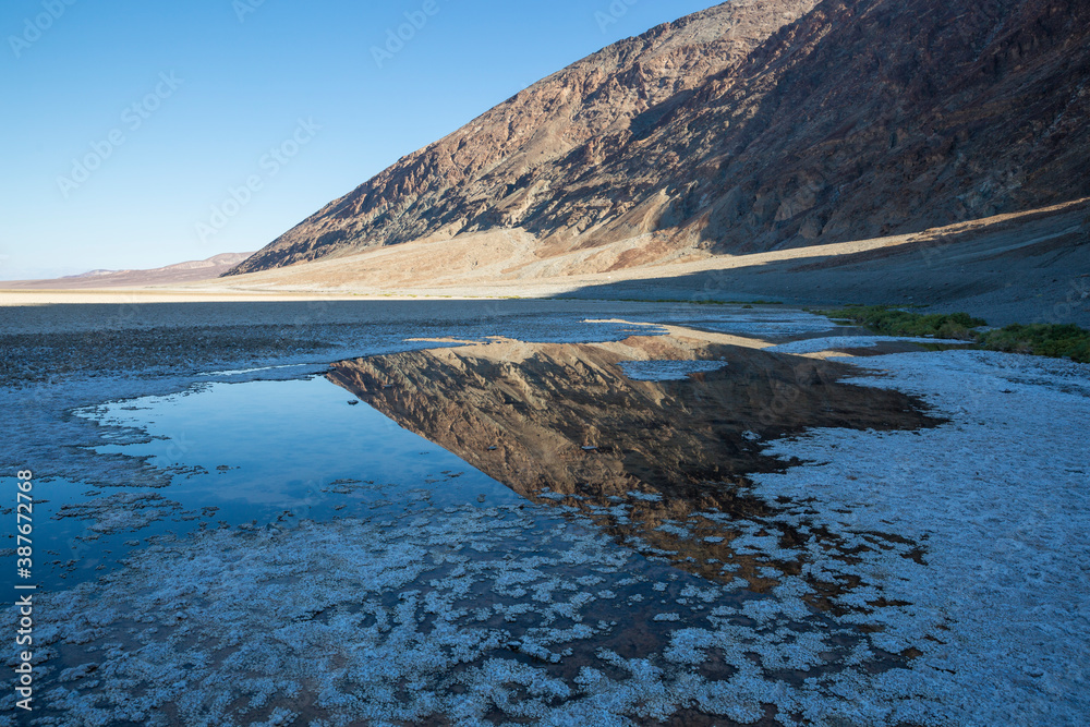 Fototapeta premium The salt bed of Badwater Basin, the lowest point in North America at -282 feet, in Death Valley National Park in California.