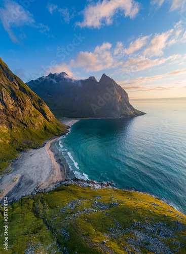 Aerial view of Lofoten islands, Northern Norway, Kvalvika beach, during sunset.