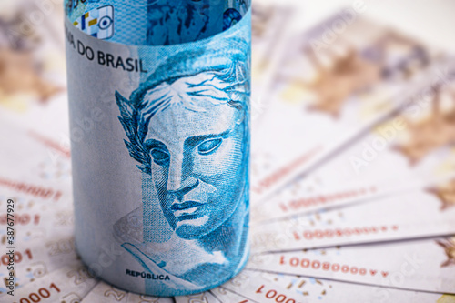 one hundred reais banknote and two hundred reais banknotes, money from brazil, conceptual image for the economy of brazil photo