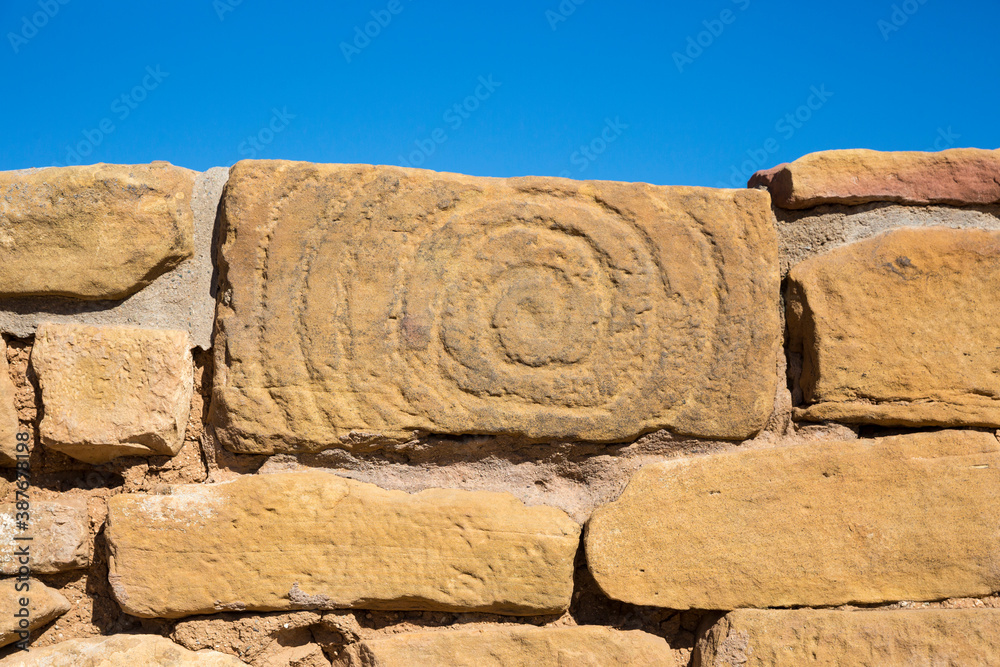 Spiral petroglyph carved into the side of a stone of the Pipe Shrine House in Mesa Verde National Park (Colorado). Spiral petroglyph carved into the side of a stone of the Pipe Shrine House in Mesa Verde National Park (Colorado).