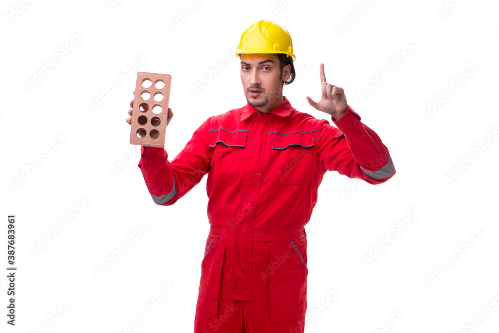Young male mason with brick isolated on white