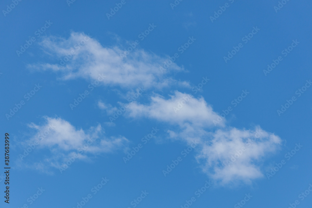 large puffy cumulus clouds bright blue sky