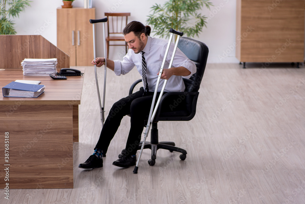 Young leg injured employee suffering at workplace